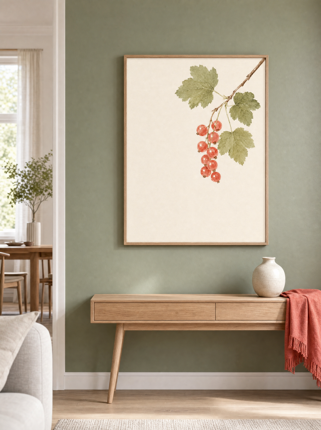 Röda Vinbär poster över konsolbord mot salviagrön vägg